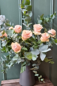 Beautiful Ecuadorian roses and Eucalyptus arrangement.